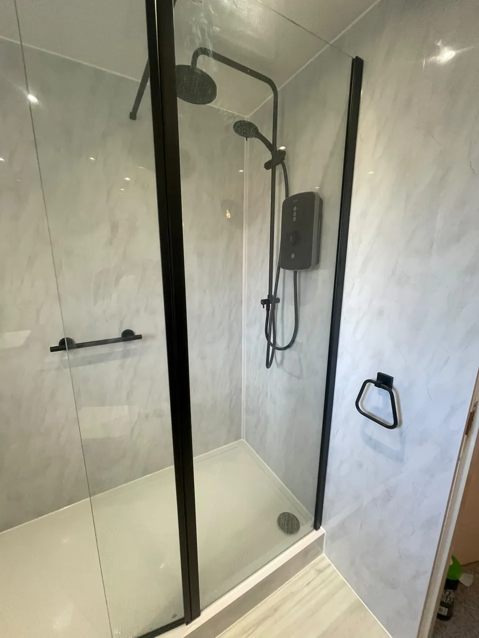 Black-framed shower screen and matching shower fittings